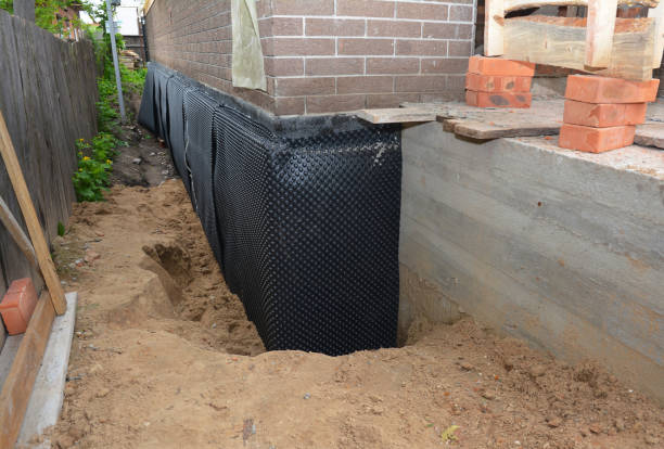 SJ Waterproofing Pros technician performing targeted Wet Basement Repair assessment in Attalla, AL
